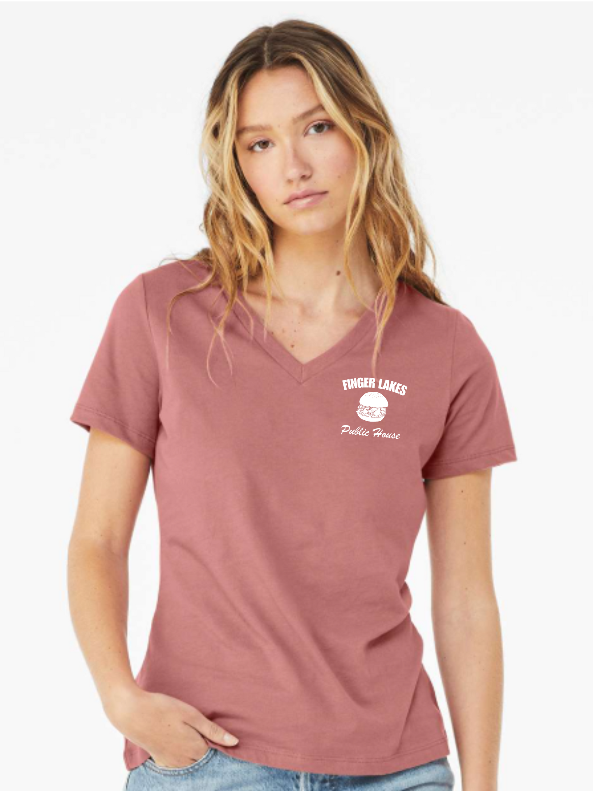 Woman wearing a mauve t-shirt with a logo on a white background